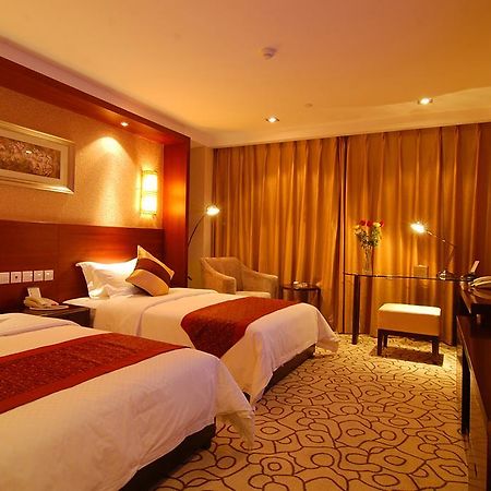 Dynasty International Hotel Kunming Quarto foto